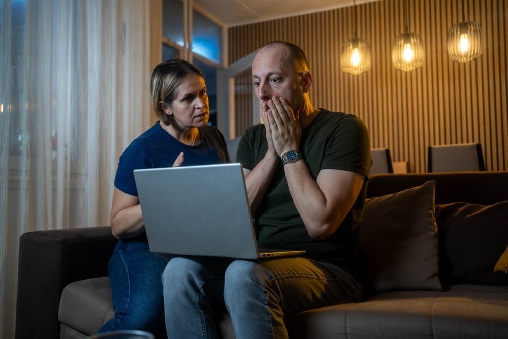Young adult reviewing household budget and housing costs